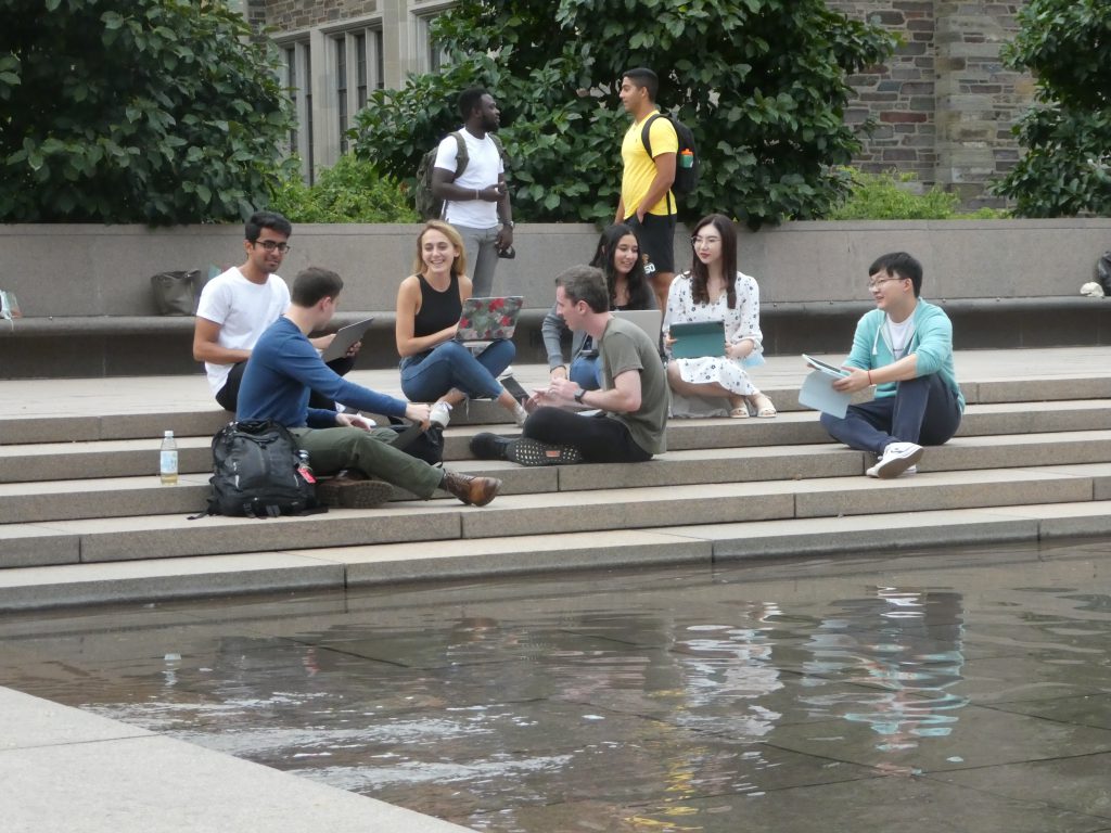 BCF Master in Finance Students Gather Near Reflecting Pond